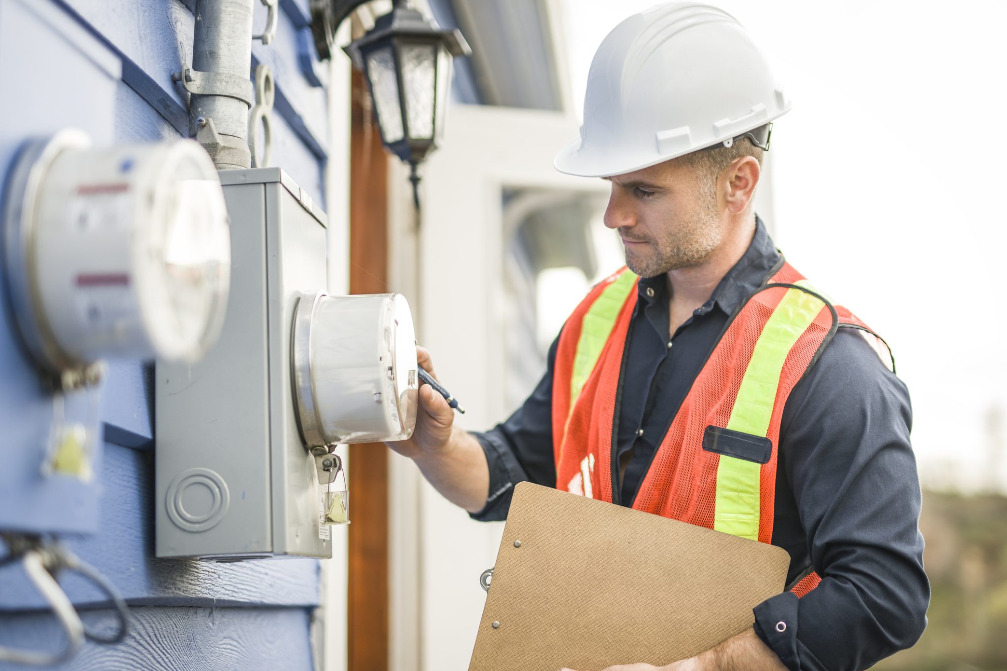 A licensed electrician in Scottsdale, AZ, inspects an electrical panel, ensuring safe wiring, proper labeling, and efficient power distribution.