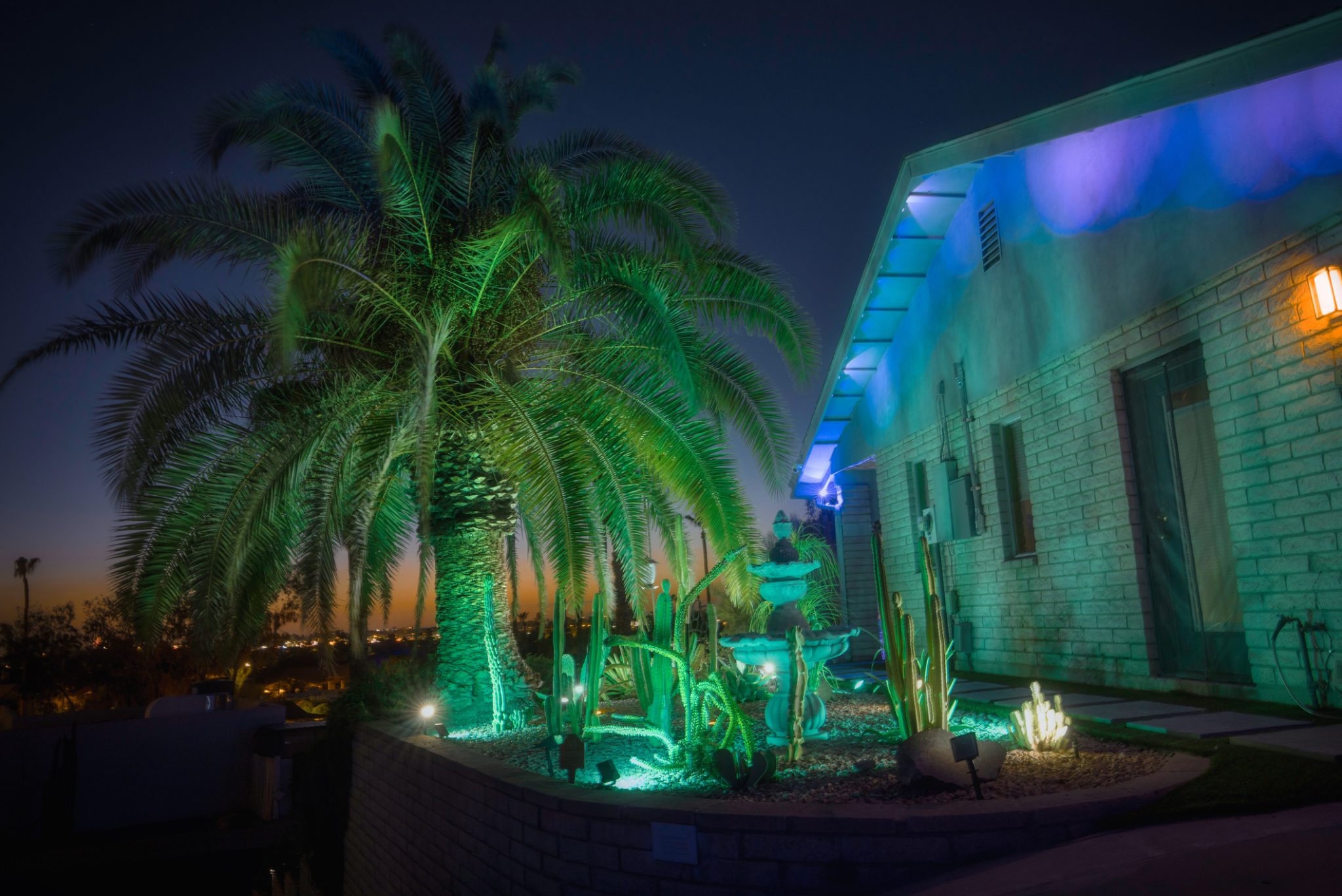 Desert home with cactus garden at dusk, showing outdoor landscape ideas in Arizona.